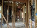 Exposed framing and electrical in a large, unfinished interior area of the home at 2039 Harwinor Se Rd, Smyrna, GA 30082