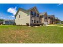 Corner-lot home features an expansive green lawn, with mature landscaping, and attached two-car garage at 2689 Muskeg Sw Ct, Atlanta, GA 30331