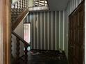 Vintage entryway featuring wallpaper and a wooden staircase at 2831 Bettis Ct, Marietta, GA 30066