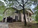 A charming two-story home with an attached garage and a wrap-around driveway at 2831 Bettis Ct, Marietta, GA 30066