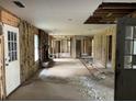 Spacious unfinished living room featuring exposed wall studs, and a fireplace, ready for customization at 644 Cambridge Dr, Marietta, GA 30066