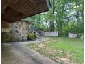 View of the backyard, showing a gazebo and damaged wooden fence at 1692 Pheasant Dr, Jonesboro, GA 30238