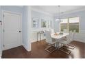 Dining room featuring modern chandelier, and a white table with seating for six at 2040 Harvest Ridge Cir, Buford, GA 30519