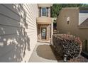 Inviting home entrance with stone accents, a welcoming wreath, and manicured landscaping at 2040 Harvest Ridge Cir, Buford, GA 30519