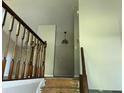 A foyer with stairs and hardwood railings needing some TLC and renovations at 2317 Wilkins Ct, Decatur, GA 30035