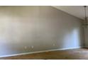 Empty living room with high ceilings ready for renovation at 2317 Wilkins Ct, Decatur, GA 30035