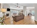 Spacious living room with hardwood floors, fireplace, and large windows for natural light at 2780 Matlin Way, Buford, GA 30519