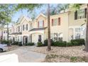 Inviting townhome exterior with attractive architectural details and manicured grounds at 6073 Camden Forrest Dr, Riverdale, GA 30296