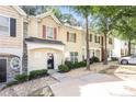 Lovely townhome featuring a cozy entrance and beautifully landscaped front yard at 6073 Camden Forrest Dr, Riverdale, GA 30296