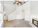 Bright living room with soaring ceilings, fireplace, and neutral decor at 6073 Camden Forrest Dr, Riverdale, GA 30296