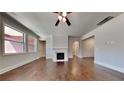 Bright living room with hardwood floors, a cozy fireplace, and lots of natural light at 9866 Garden Hill Ln, Douglasville, GA 30135
