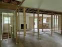 Open-concept living area ready for renovation, featuring a fireplace and natural light at 7235 Thornhill Ne Ln, Atlanta, GA 30328