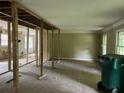 Spacious living area undergoing remodeling, offering potential for customization at 7235 Thornhill Ne Ln, Atlanta, GA 30328