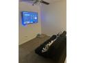 Cozy living room with a large TV, carpet, and a comfortable sofa at 1263 Brookstone Rd, Atlanta, GA 30349