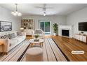 Bright living room with fireplace, hardwood floors, and access to the outdoors at 2031 Austin Park Cir, Decatur, GA 30032