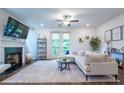 Bright living room with fireplace, french doors, and open layout at 3518 Mount Blue Ave, Tucker, GA 30084