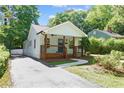 Inviting home with a classic front porch and neatly kept driveway leading to the residence at 5 Windsor Ter, Avondale Estates, GA 30002