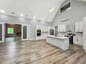 Bright kitchen with white cabinetry, stainless steel appliances, and a large island for dining at 244 Coastline Road Rd, Fayetteville, GA 30214
