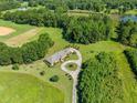 Expansive estate features a luxurious home, circular driveway, and lush green surroundings at 226 Euharlee Five Forks Rd, Kingston, GA 30145