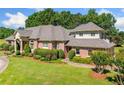 Elegant brick home with manicured landscaping and architectural details at 226 Euharlee Five Forks Rd, Kingston, GA 30145