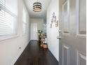Inviting entryway featuring hardwood floors, natural light and modern decor, offering a warm welcome into the home at 4406 Richmond Court Ct, Stone Mountain, GA 30083