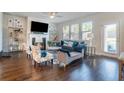 Cozy living room with fireplace, lots of natural light, and comfortable seating, perfect for relaxation and entertaining at 4406 Richmond Court Ct, Stone Mountain, GA 30083