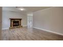 Bright living room showcasing new floors and a stone fireplace, great for entertaining guests at 924 Park Gate Pl, Stone Mountain, GA 30083
