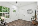 Welcoming entryway with wood-look floors, a window, and a door with glass insert for natural light at 2160 Perkerson Sw Rd, Atlanta, GA 30315