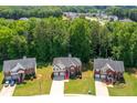 Beautiful aerial view showcasing the home's location within a friendly neighborhood, surrounded by lush greenery and well-maintained lawns at 4348 Tillage Path, Douglasville, GA 30135