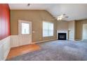 Cozy living room with a fireplace, large window, and a door leading to the outside at 580 Camry Cir, Dallas, GA 30157