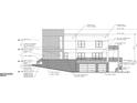 A modern house with a garage, featuring cementitious panels, aluminum windows, and vertical wood siding accents at 1301 Lavista Ne Rd, Atlanta, GA 30324