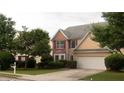 Charming home with two-car garage, neat landscaping, bay window, and red-shuttered windows at 3292 Shady Valley Ct, Loganville, GA 30052