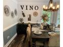 Stylish dining room featuring elegant decor, a rustic table and wine-themed accents at 40 Legend Creek, Douglasville, GA 30134