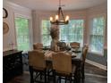 Cozy dining area bathed in natural light, featuring a rustic table set for an inviting meal at 40 Legend Creek, Douglasville, GA 30134