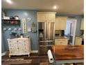 Well-lit kitchen with stainless steel appliances, light-colored cabinetry, and a butcher block island at 40 Legend Creek, Douglasville, GA 30134