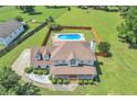 Aerial view showcases a pool, expansive yard, and the home's architectural design at 161 Honey Creek Rd, Mcdonough, GA 30252