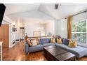 Spacious living room with hardwood floors, comfortable sectional sofa, and ample natural light at 6195 Queensdale Dr, Douglasville, GA 30135