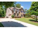 Beautiful home with a long driveway, side entry garage, and a well-kept lawn at 2470 Anderson Estates Ct, Marietta, GA 30064