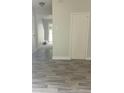 Hallway with hardwood floors and neutral paint colors leading to other rooms at 3530 Hopkins Ct, Powder Springs, GA 30127