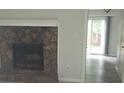 Cozy living room featuring a stone fireplace and sliding glass doors to the back at 3530 Hopkins Ct, Powder Springs, GA 30127