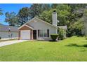 Charming single-story home with well-maintained lawn and attached one-car garage at 4378 Chestnut Oaks Trce, Lithonia, GA 30038