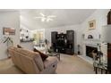 Bright living room features a fireplace, vaulted ceilings, and modern decor at 4378 Chestnut Oaks Trce, Lithonia, GA 30038