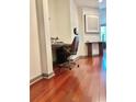 Home office nook with wood desk, chair, recessed lighting, and wood floors at 855 Peachtree Ne St # 1406, Atlanta, GA 30308