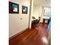 Home office with modern desk and chair, recessed lighting, and wood flooring at 855 Peachtree Ne St # 1406, Atlanta, GA 30308