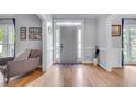 Welcoming foyer with hardwood floors, gray walls, and sidelight windows at 3250 Cobbs Farm Nw Trl, Marietta, GA 30064