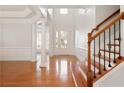 Bright foyer with hardwood floors, staircase, pillars, and natural light at 4652 Prater Se Way, Smyrna, GA 30080