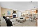 Comfortable living room with a fireplace, open to the dining and kitchen areas at 98 Hampshire Ct, Avondale Estates, GA 30002