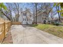 View of a two-story home with a long driveway leading to the front entrance at 2453 Paul Nw Ave, Atlanta, GA 30318