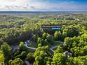 Expansive aerial view showcases the property's lush surroundings in Loganville, Georgia at 4085 Fawn Valley Dr, Loganville, GA 30052