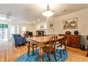 Cozy dining room with hardwood floors, a blue rug, and lots of light leading into an adjacent sitting room at 1750 Clairmont Rd # 35, Decatur, GA 30033